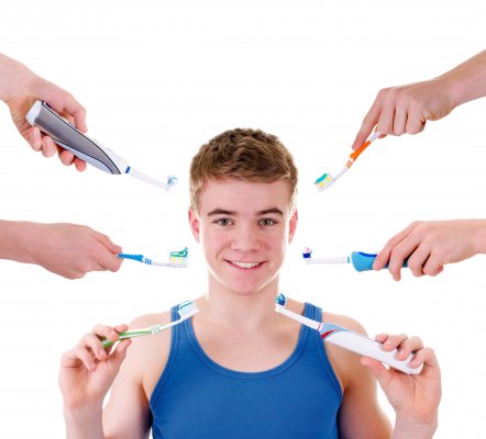 guy with lots of toothbrush options